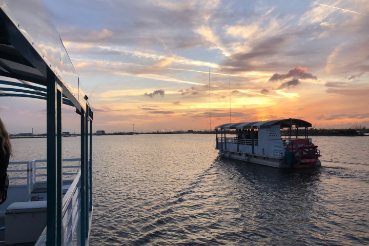 a boat is docked next to a body of water