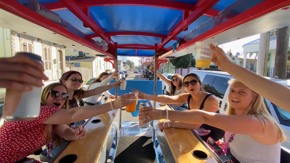 a woman sitting at a table in front of a building