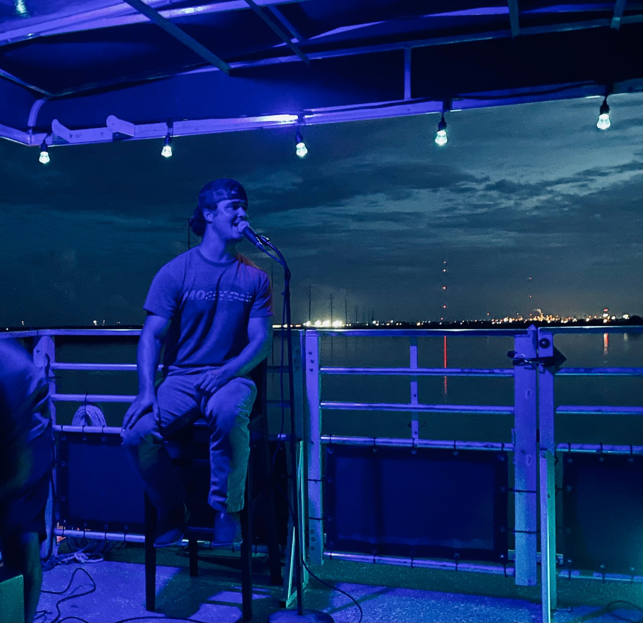 a man sitting on a stage