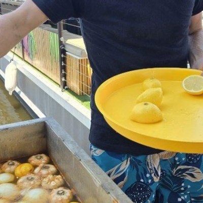 a man holding a donut
