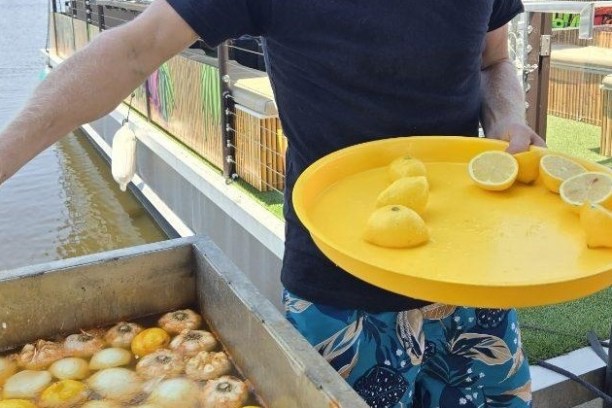 a man holding a donut